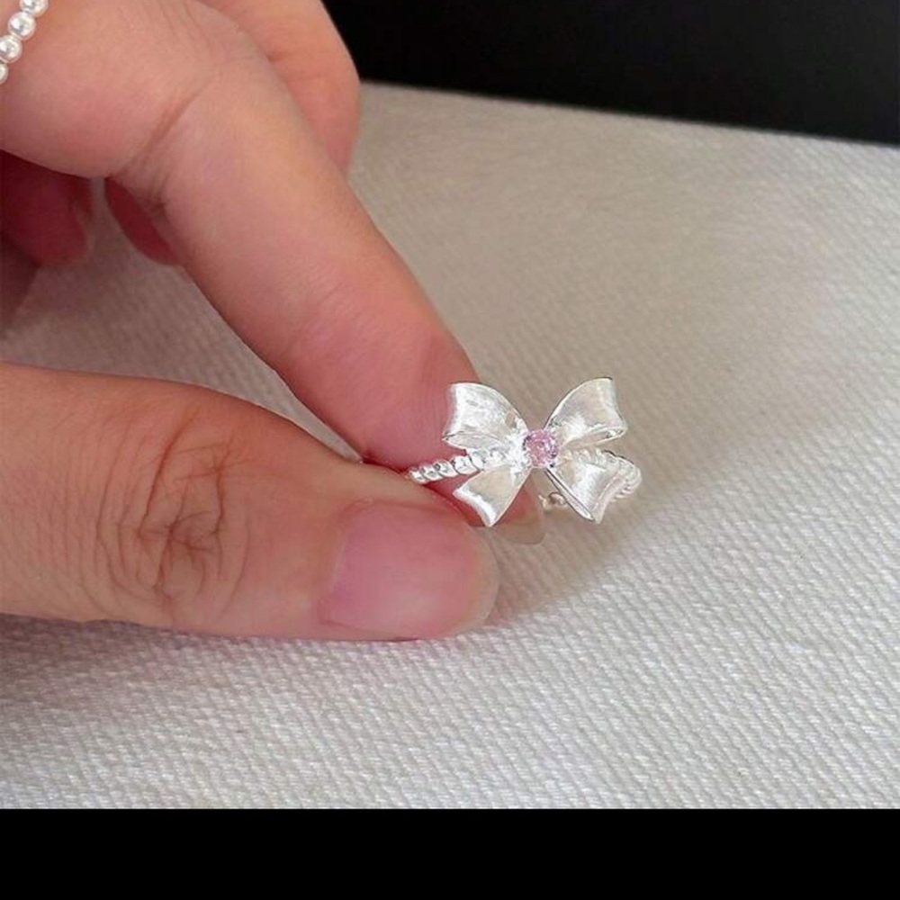 Silver Bow Ring with Pink Gem